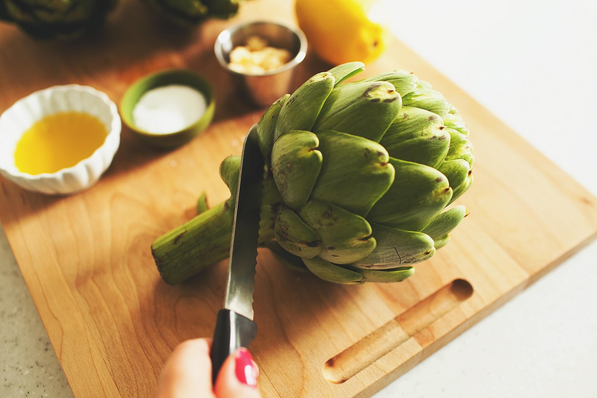 How to Cook Crockpot Artichokes: Step 2 trim stem