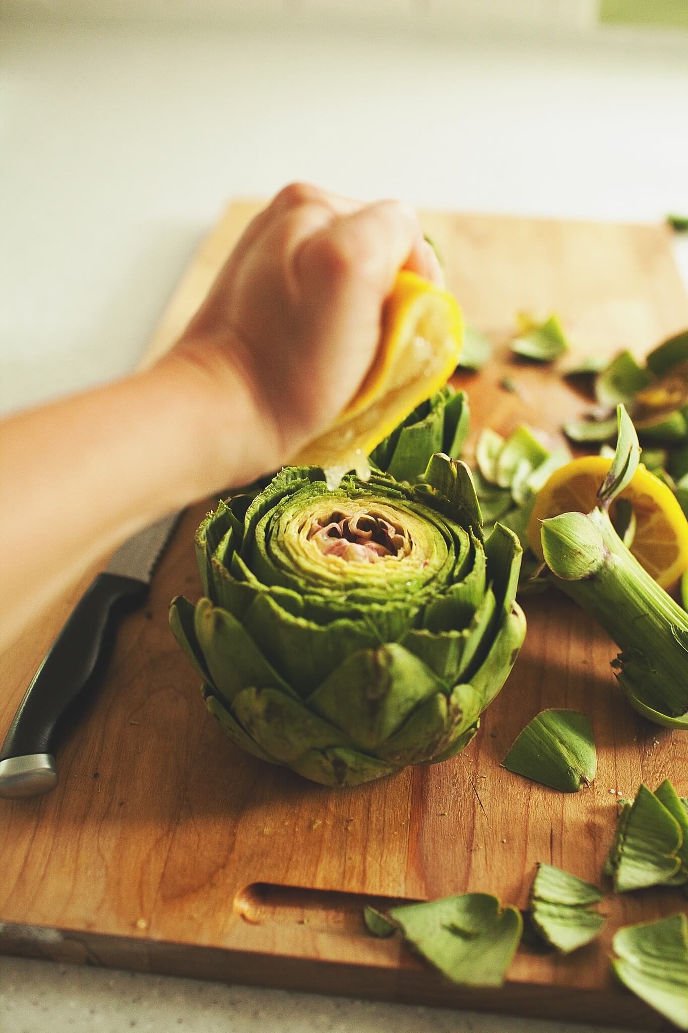 How to Cook Crockpot Artichokes - Step 6: squeeze lemon over artichokes