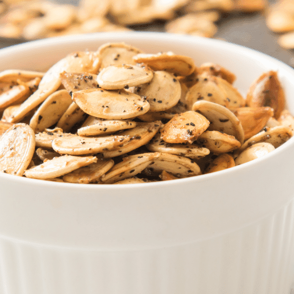 Roasted Pumpkin Seeds in white bowl