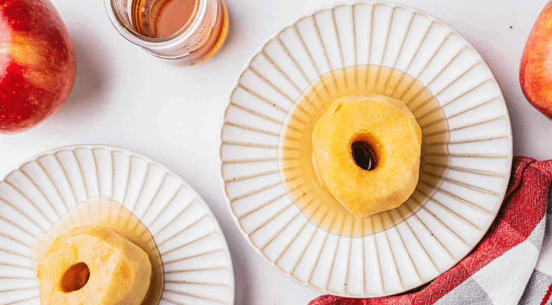 Poached apples on white plates