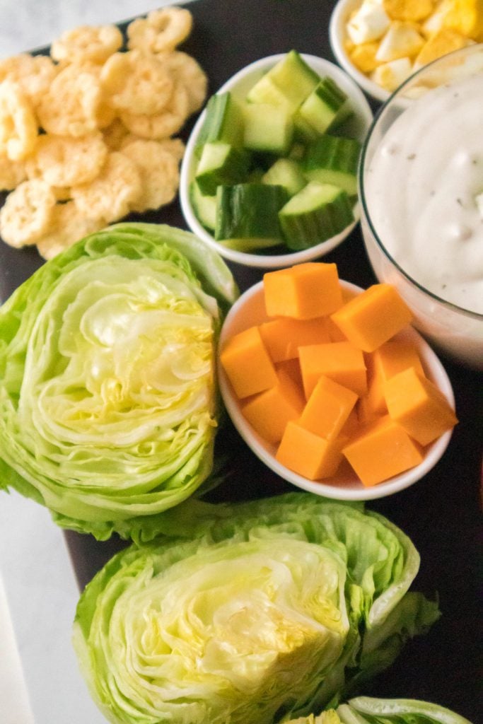 close up of baby iceberg lettuce and toppings