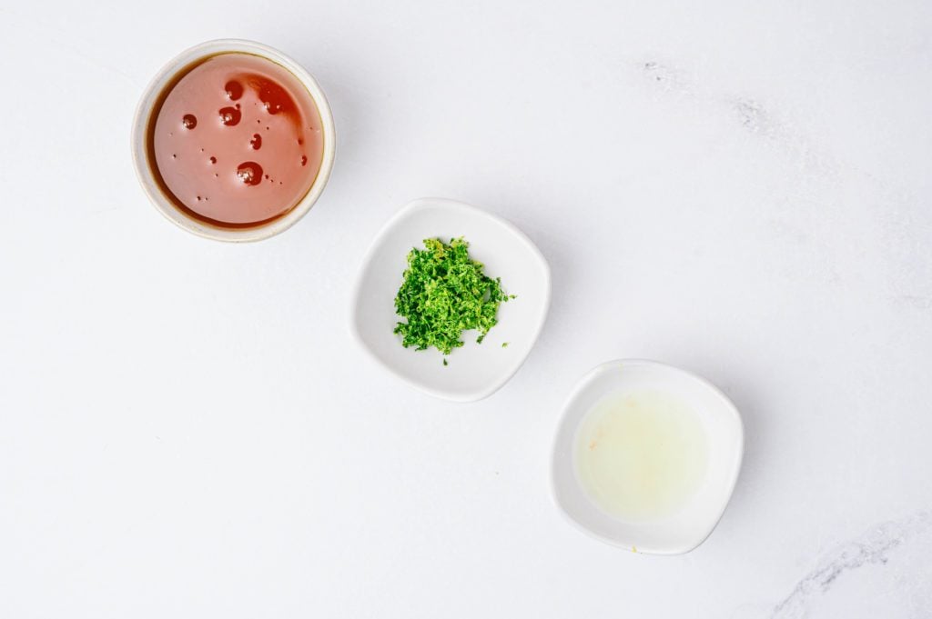 honey, lime zest and lime juice in white square bowls