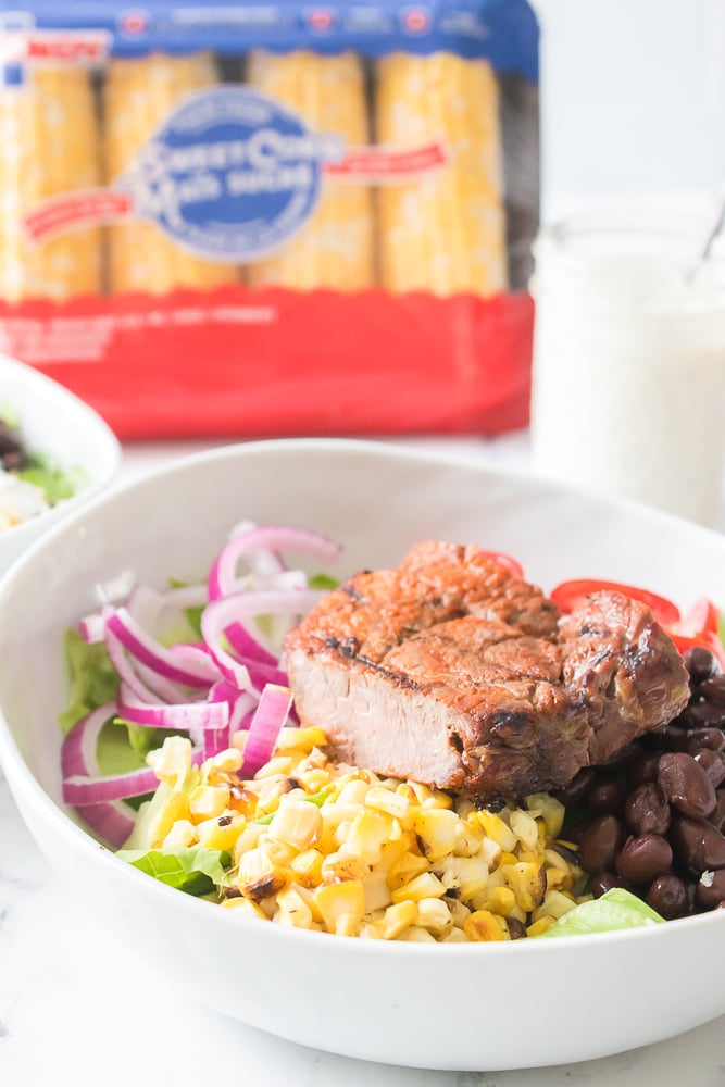 vertical image of Grilled Southwestern Steak Salad in a bowl