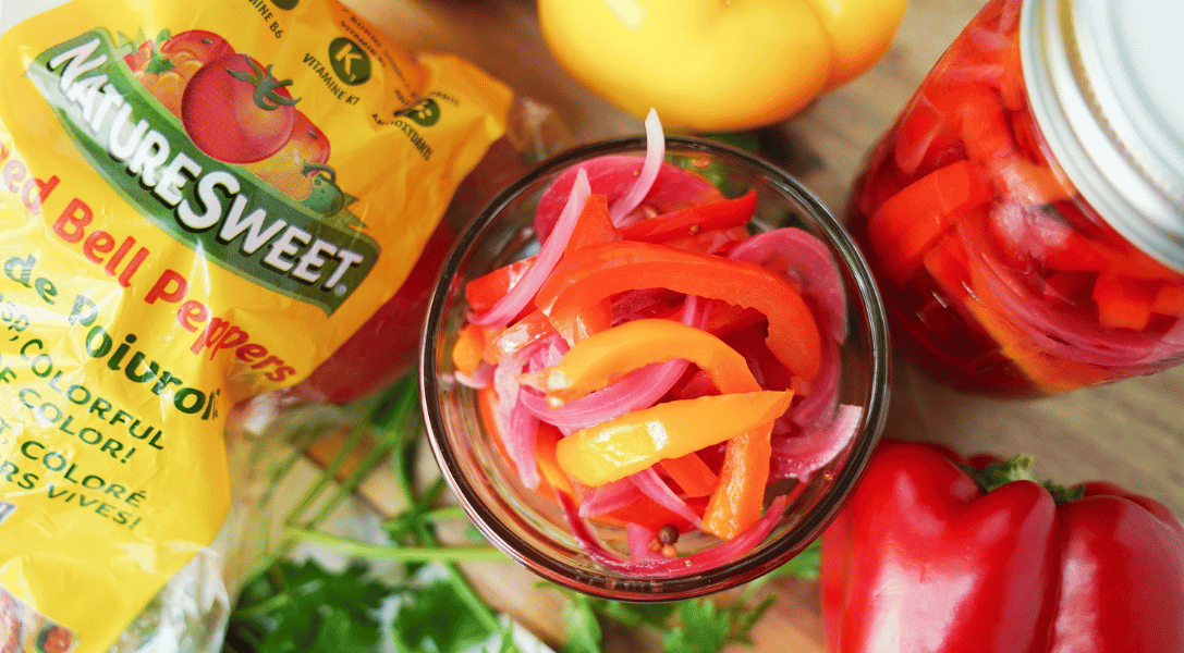 Pickled Bell Peppers in mason jar with NatureSweet packaging