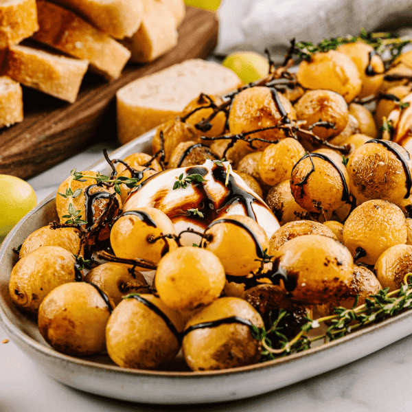 Burrata and Roasted Grapes on platter with bread