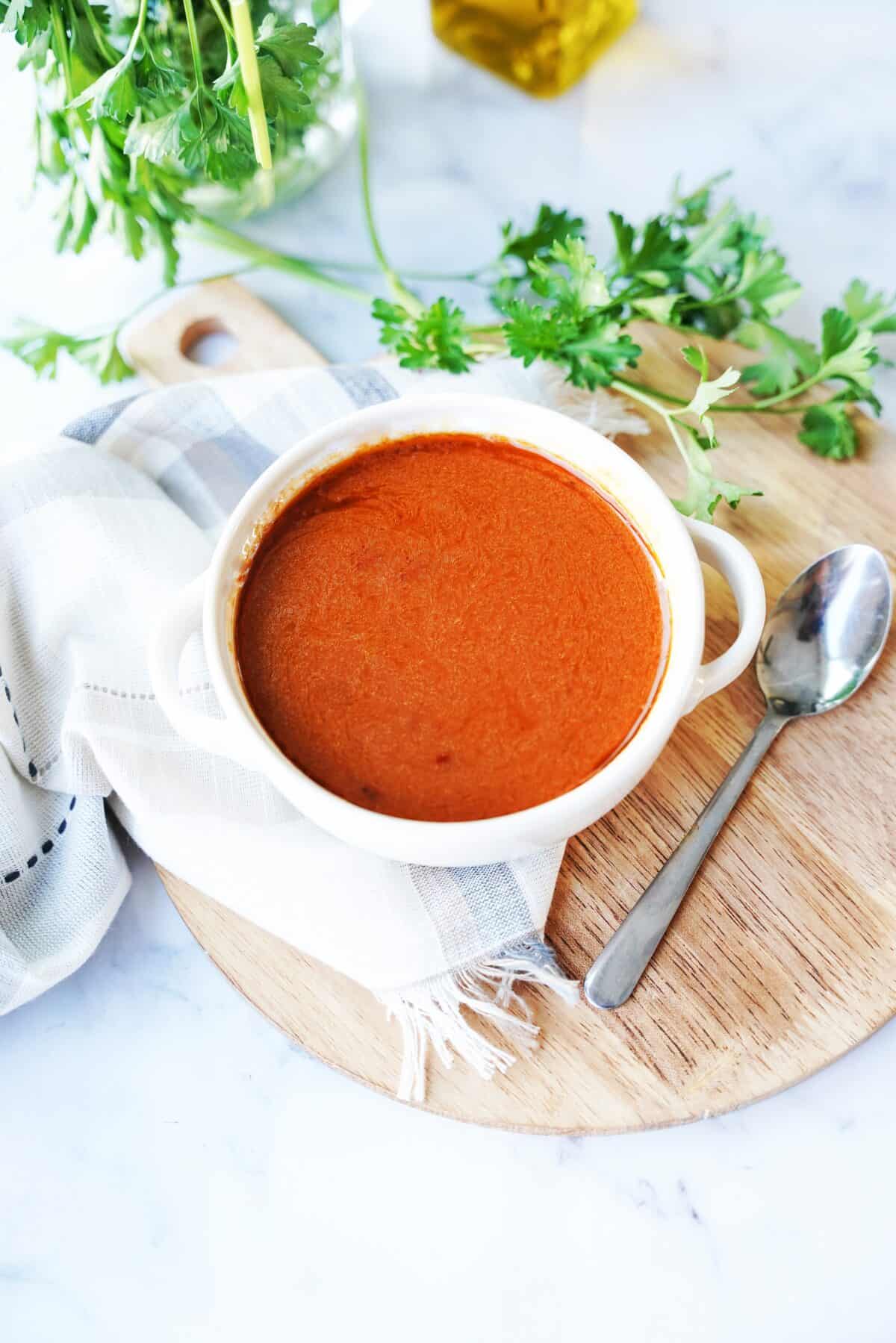 shot of patatas bravas sauce in white bowl