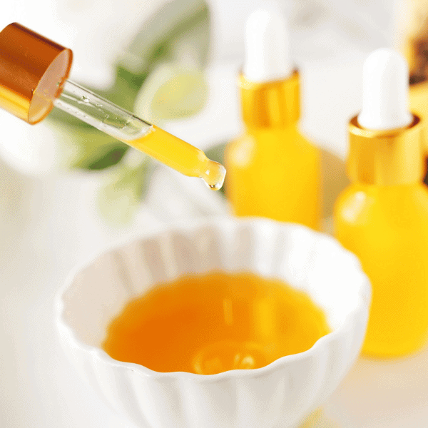 Papaya Oil Dripping into white bowl