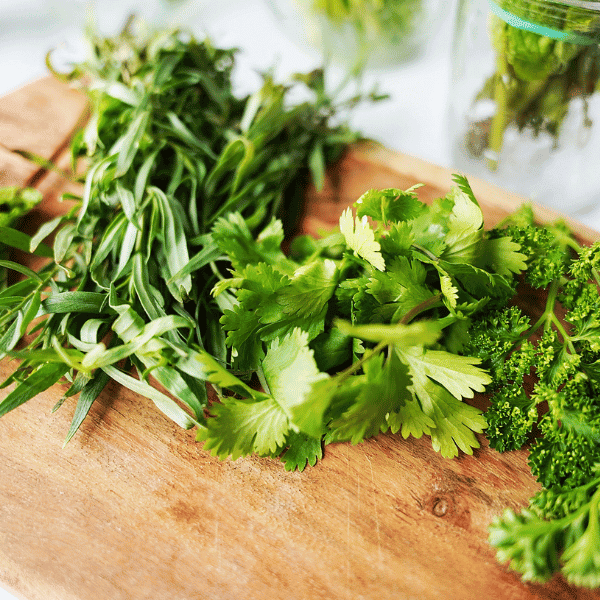 fresh herbs on cutting board