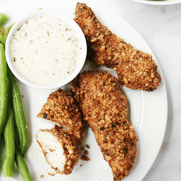 Air Fryer Chicken Tenders with Walnut Crusts on plate with green beans