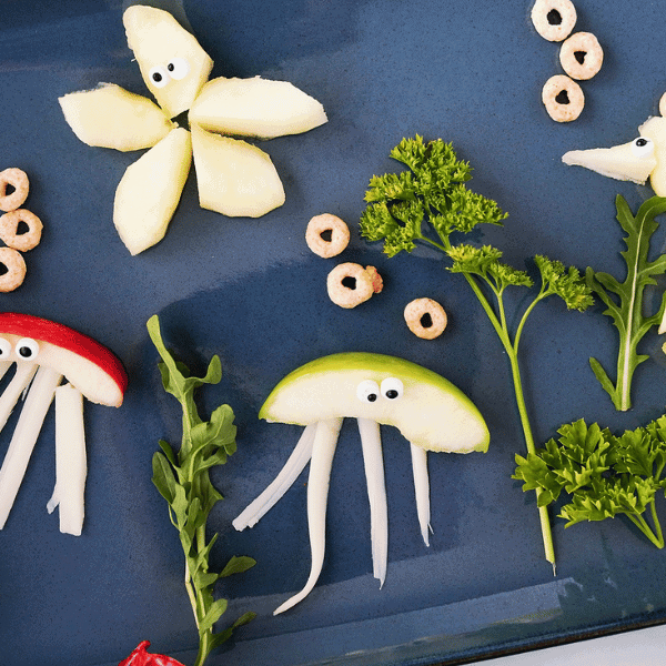 Under the Sea creatures made from apples on blue plate