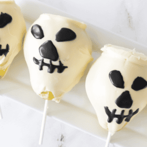 Chocolate-Covered Pear Skulls on white plate