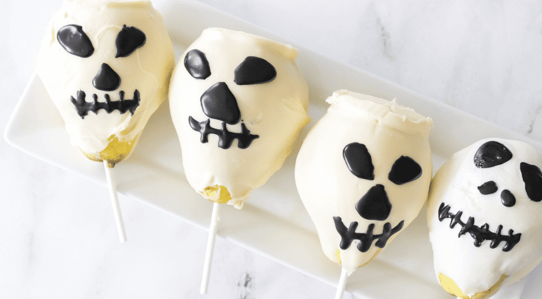 Chocolate-Covered Pear Skulls on white plate