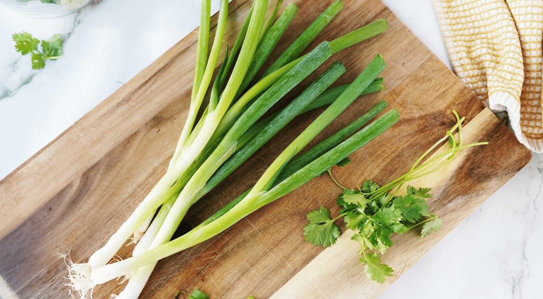 Green onions on cutting board