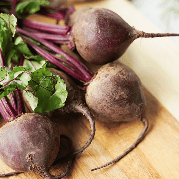 Whole Beets on cutting board