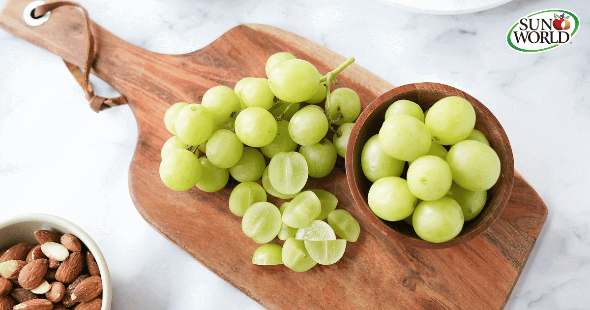 Sun World Green Grapes on cutting board