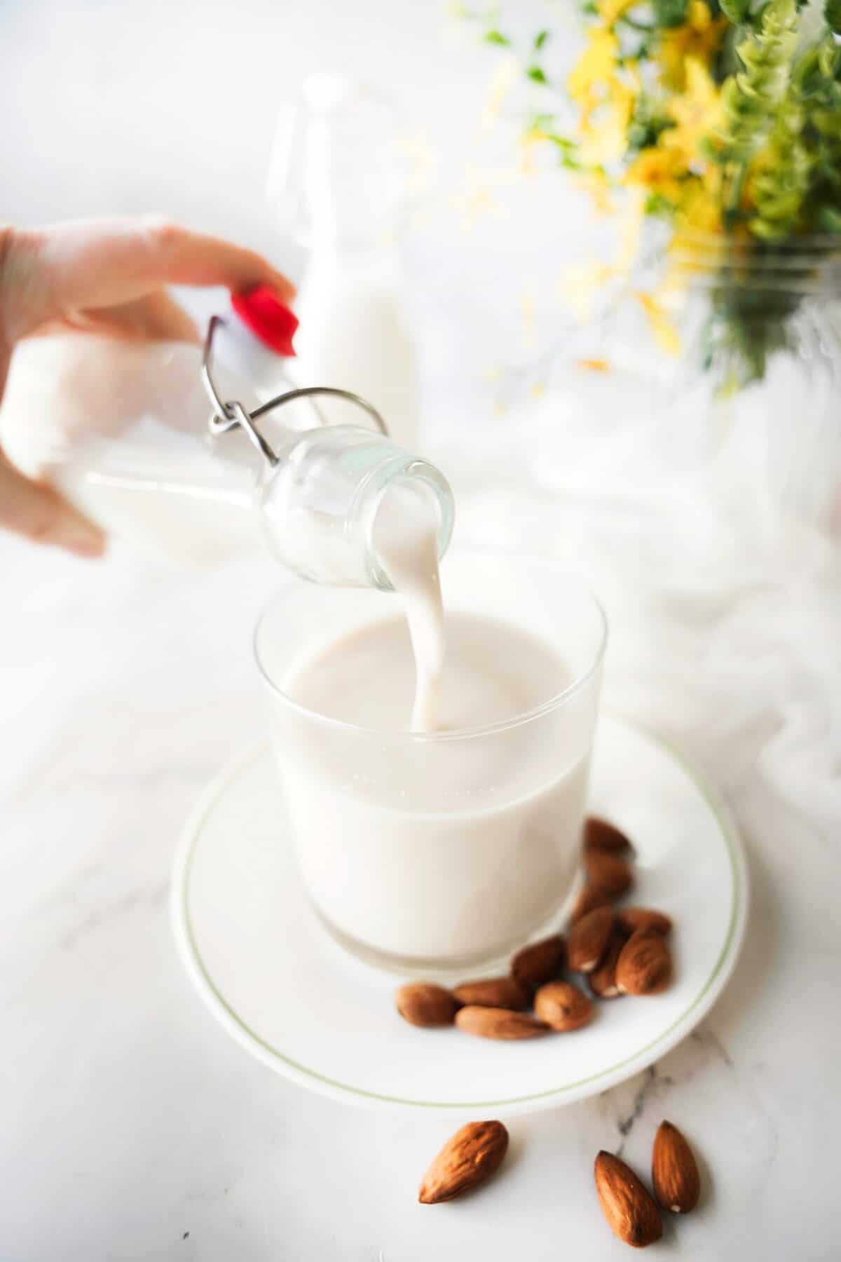 almond milk being pouted into a cup