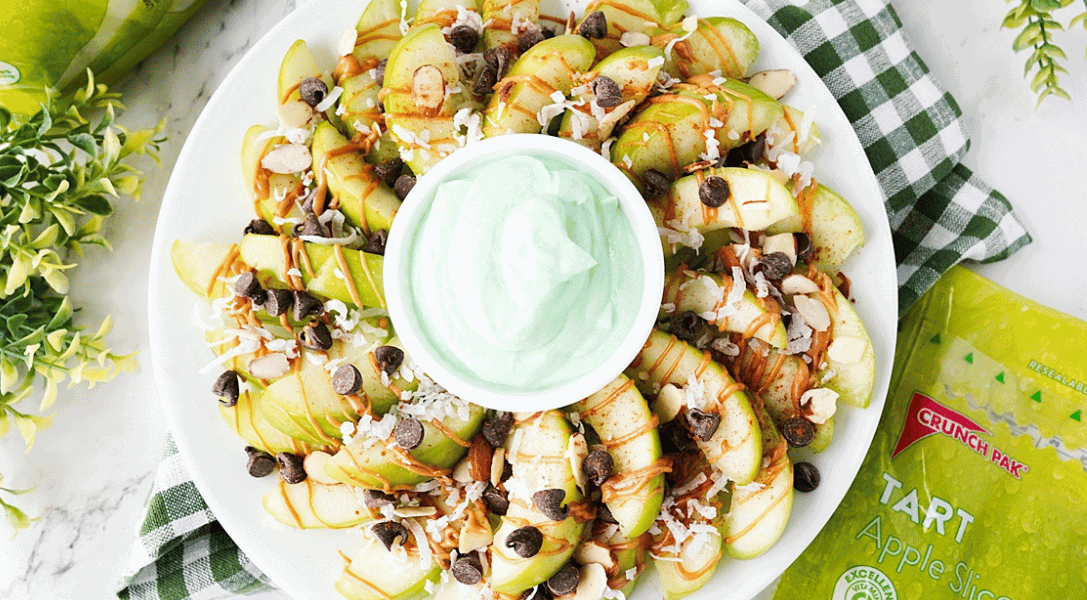 Green apple nachos with green fruit dip in the middle