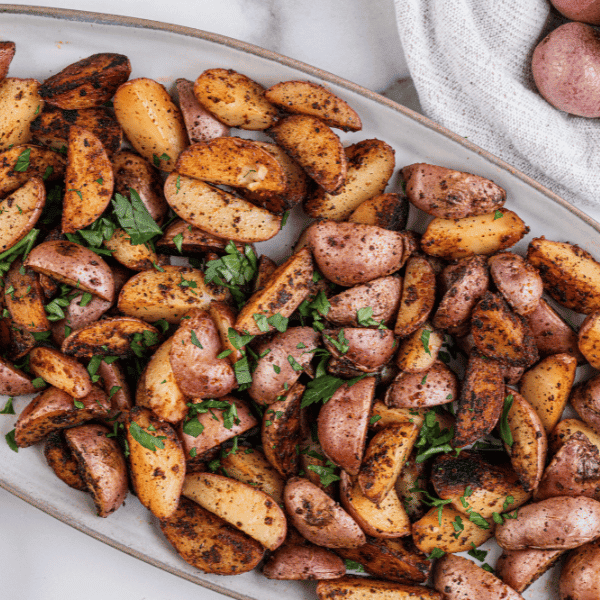 Breakfast potatoes on white plate