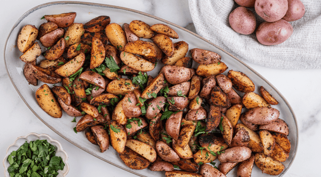 Breakfast potatoes on white plate