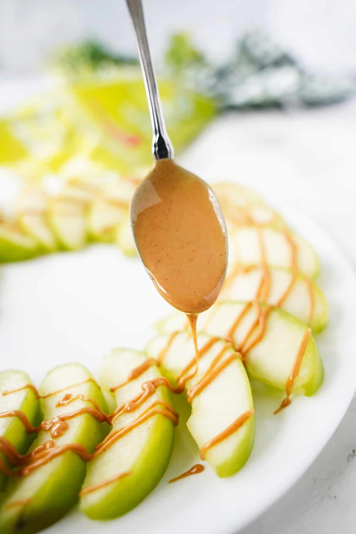 Drizzle melted almond butter over the apple slices